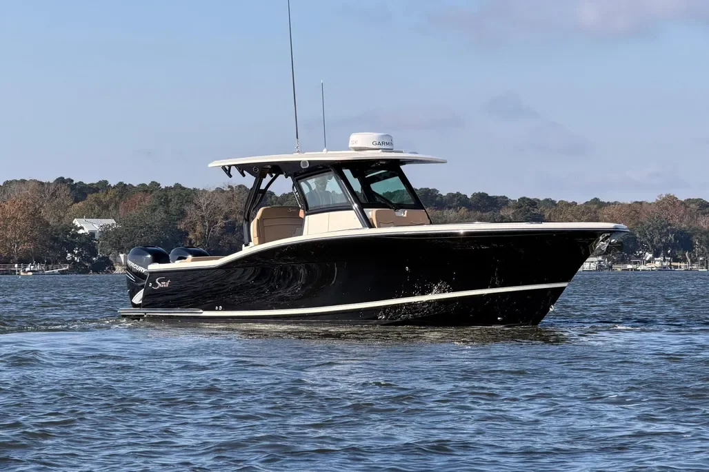Actual black-hulled 2022 Scout 330 LXF photographed on the water